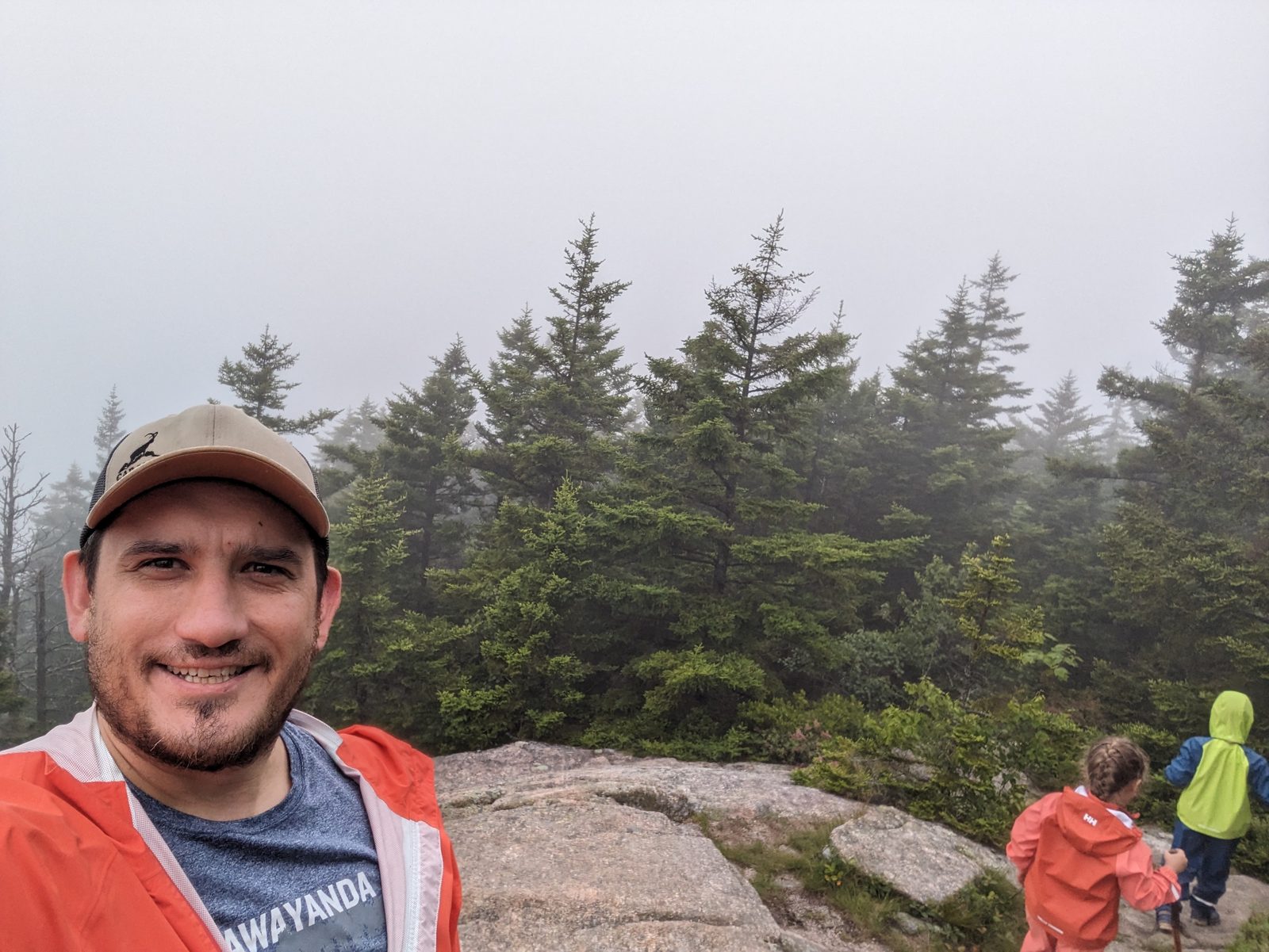 Foggy summit with family
