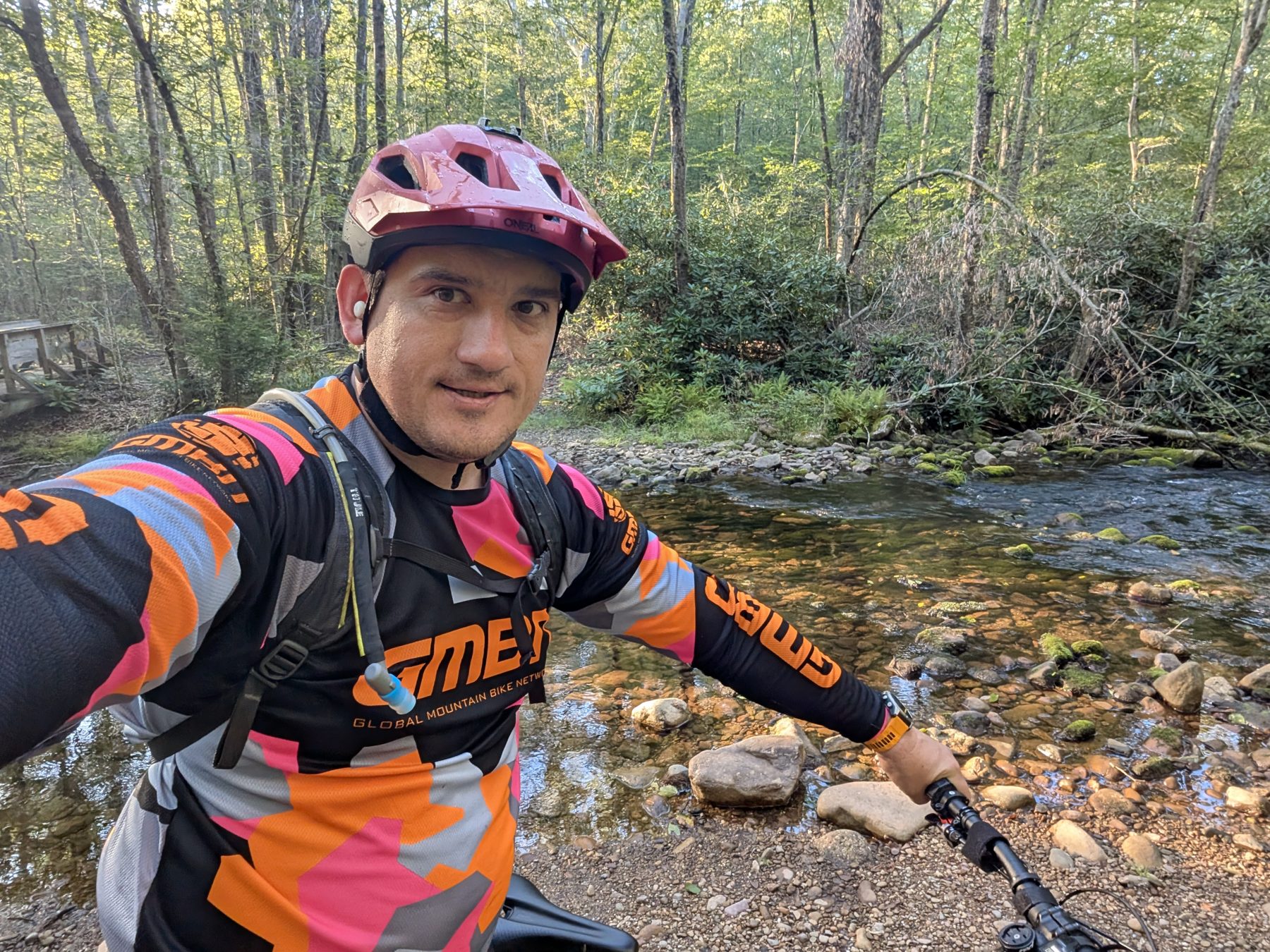 Mountain biking by a creek