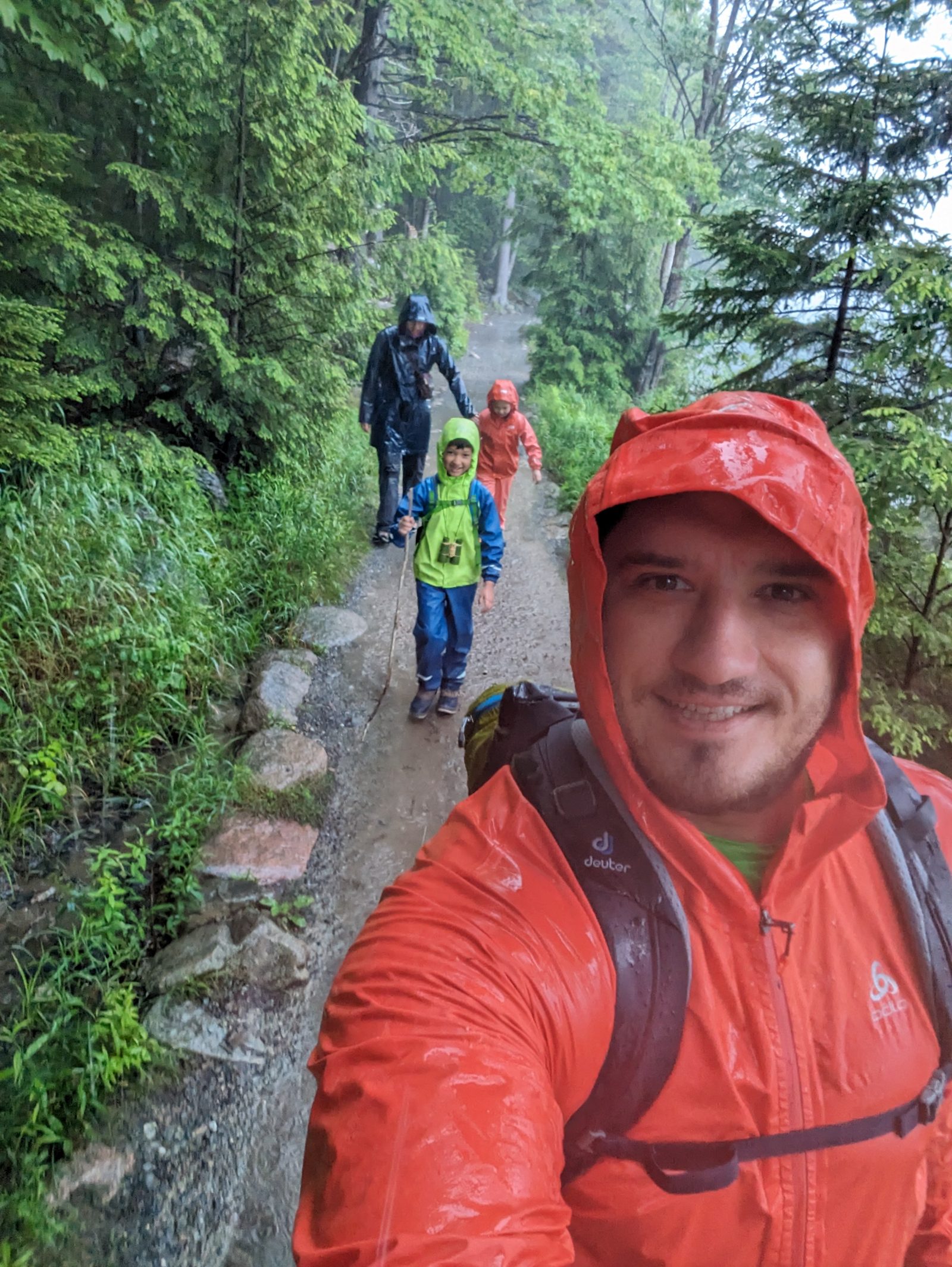 Rainy trail hike with family